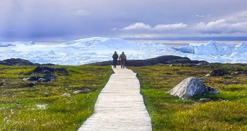 Greenland landscape with boardwalk and glacier